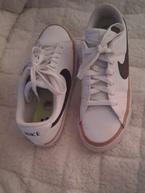 Nike Kids White Sneakers with Black Swoosh and Gum Trim